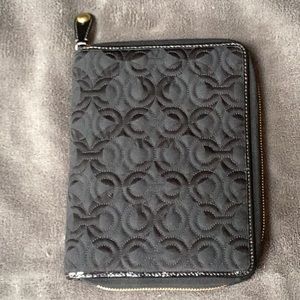 Coach zippered notebook.